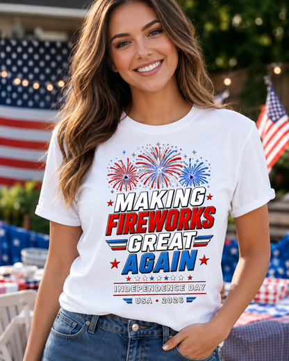 Woman wearing a white t-shirt with 4th of July-themed text and graphics, standing outdoors with American flags in the background.